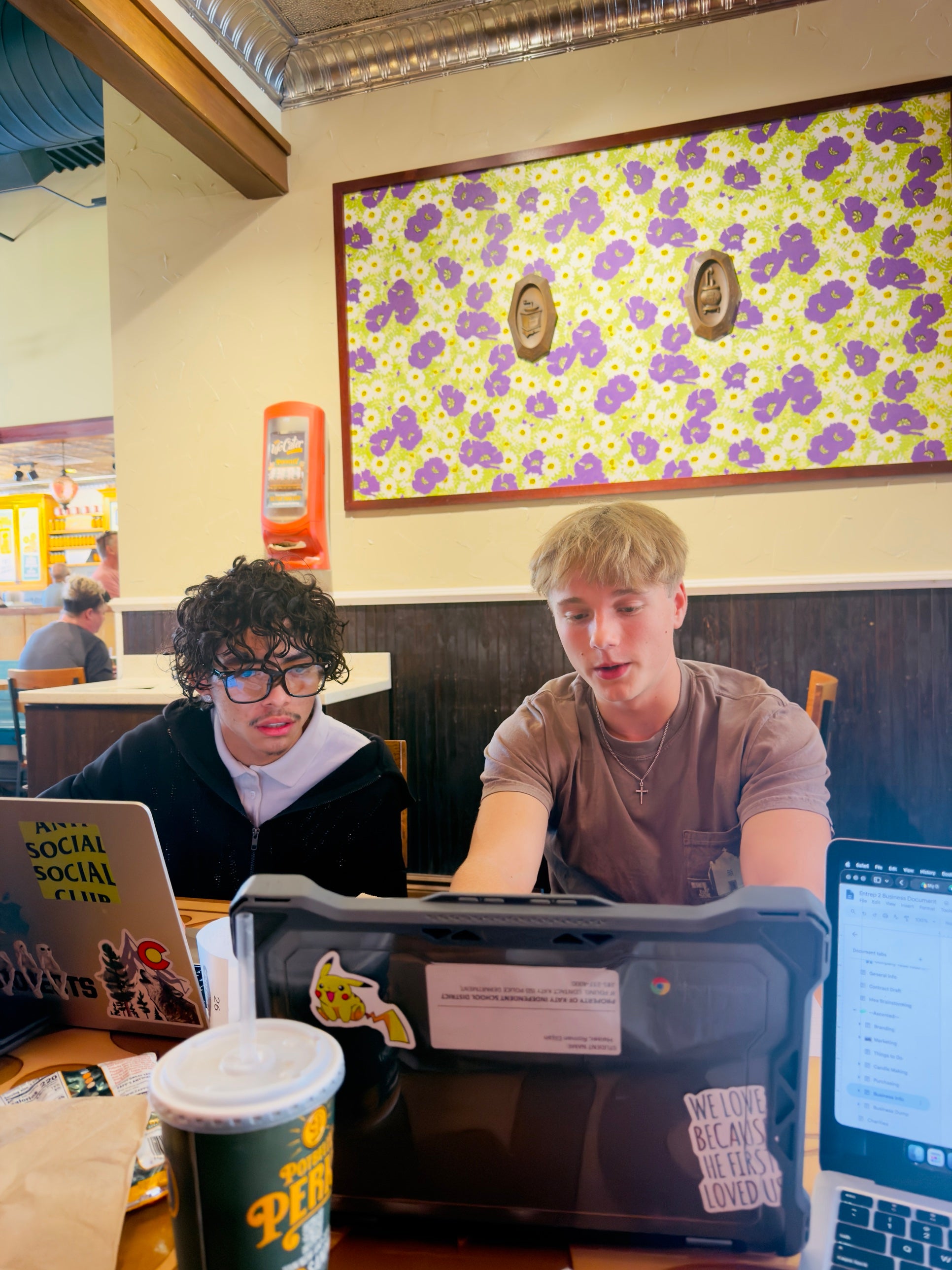 The Ascented team working on laptops planning an order