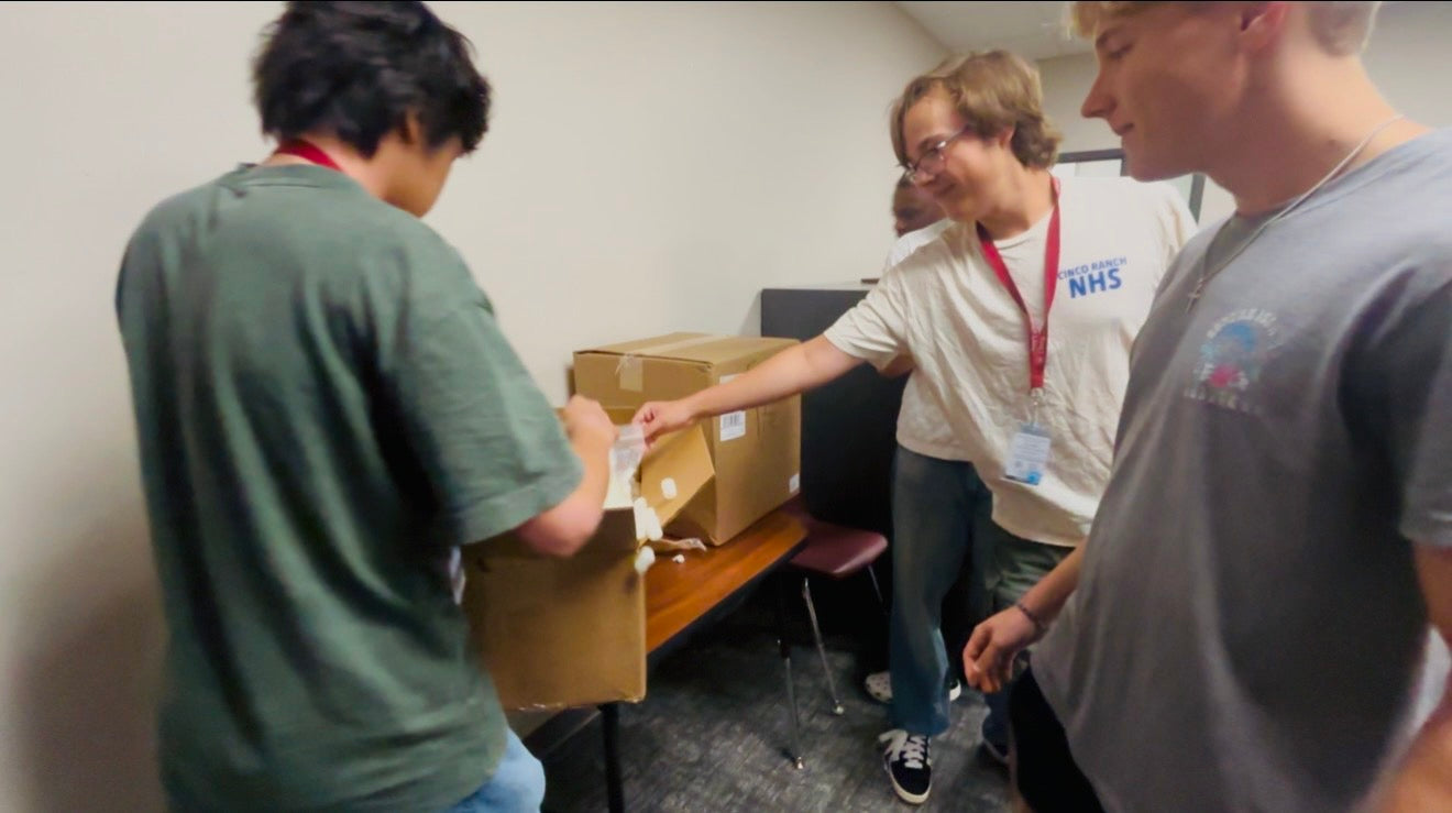 The Ascented team unpacking a shipment together