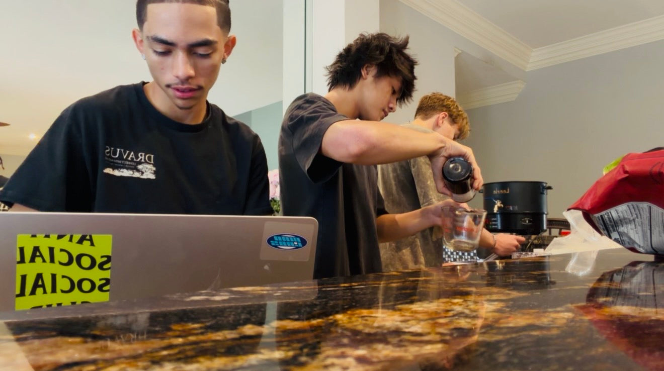 The Ascented team holding a freshly poured candle